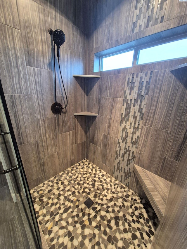 full bath with tiled shower