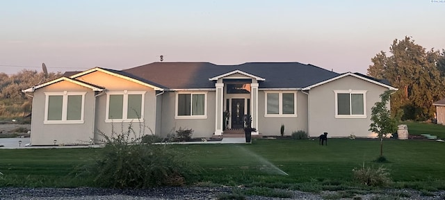 view of front of property with a lawn