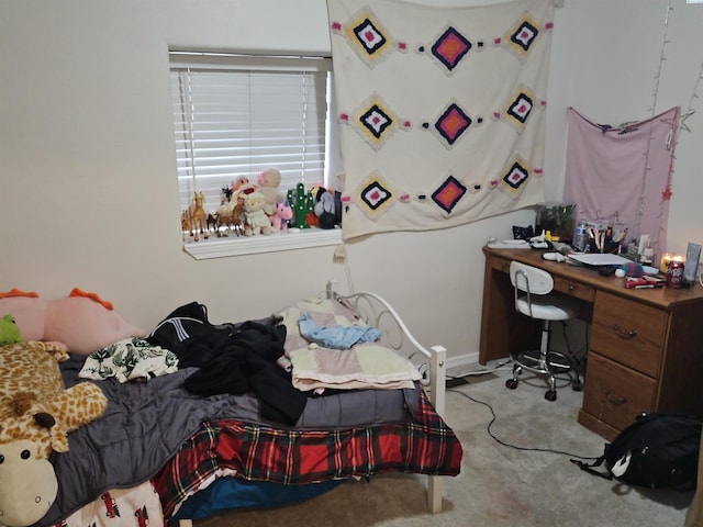 bedroom featuring light colored carpet