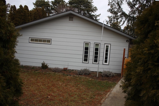 view of home's exterior featuring a yard