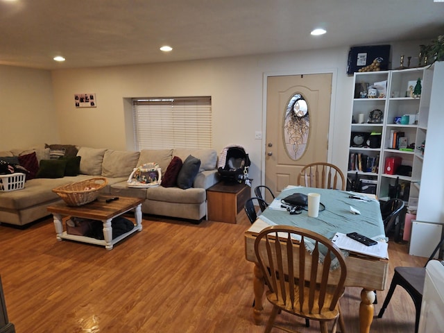 living area with wood finished floors and recessed lighting