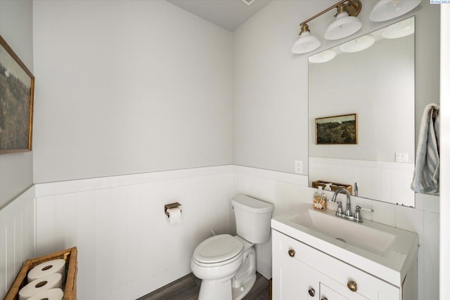 2237 Legacy Ln, Richland, WA 99352 - bathroom featuring wainscoting, vanity, and wood finished floors