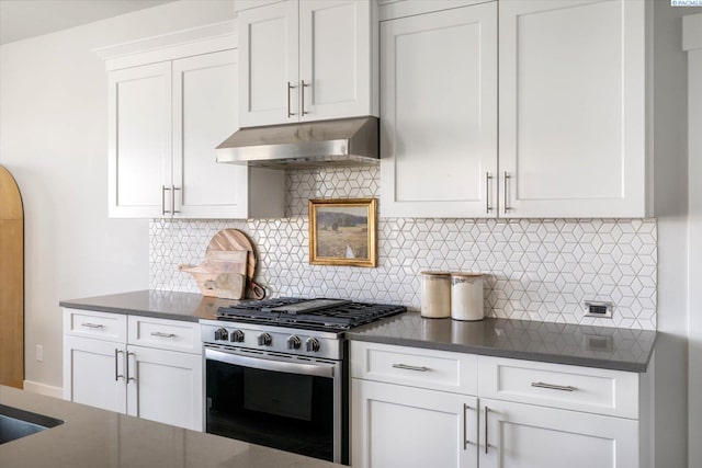 2237 Legacy Ln, Richland, WA 99352 - kitchen with gas range, under cabinet range hood, white cabinetry, and decorative backsplash