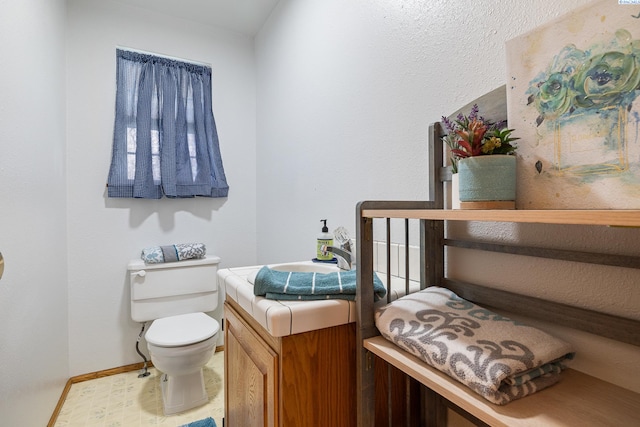 108 W 45th Ave, Kennewick, WA 99337 - half bathroom featuring tile patterned floors, baseboards, and toilet