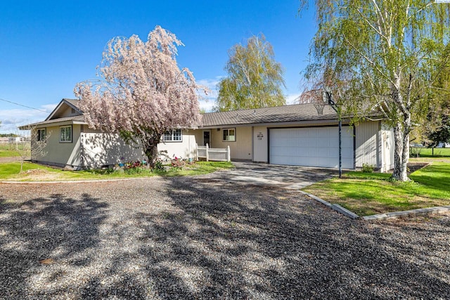 108 W 45th Ave, Kennewick, WA 99337 - view of front of home with a garage and aphalt driveway