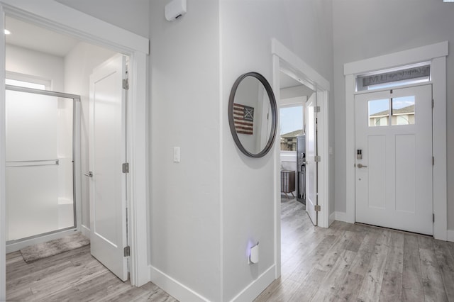 entryway with light hardwood / wood-style flooring