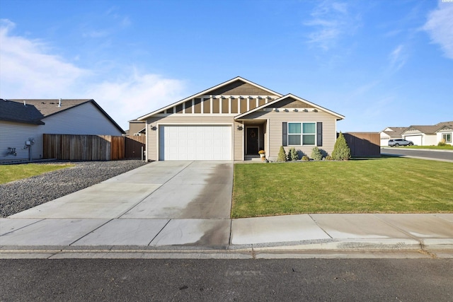 view of front of home with a garage and a front lawn