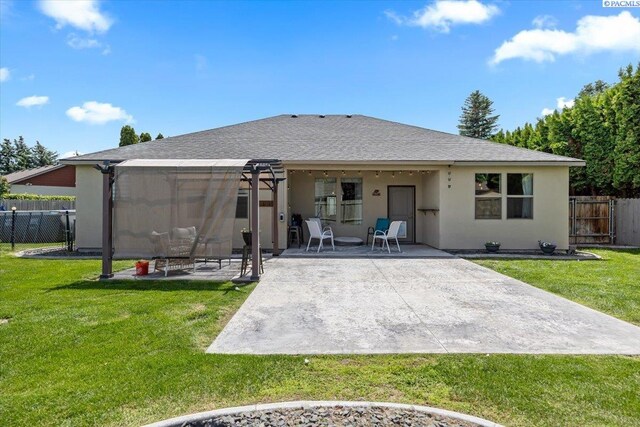 406 W 49th Ave, Kennewick, WA 99337 - rear view of property featuring a patio area, stucco siding, and roof with shingles