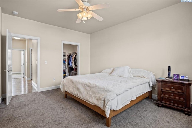 406 W 49th Ave, Kennewick, WA 99337 - bedroom with carpet flooring, a walk in closet, baseboards, a closet, and a ceiling fan