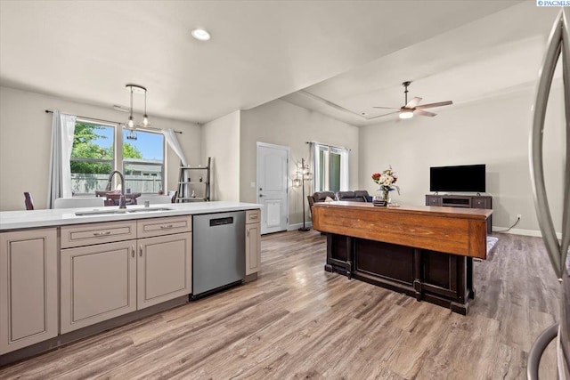 406 W 49th Ave, Kennewick, WA 99337 - kitchen featuring dishwasher, a sink, a ceiling fan, light countertops, and open floor plan