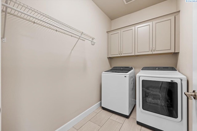 406 W 49th Ave, Kennewick, WA 99337 - laundry area featuring washing machine and clothes dryer, cabinet space, and baseboards
