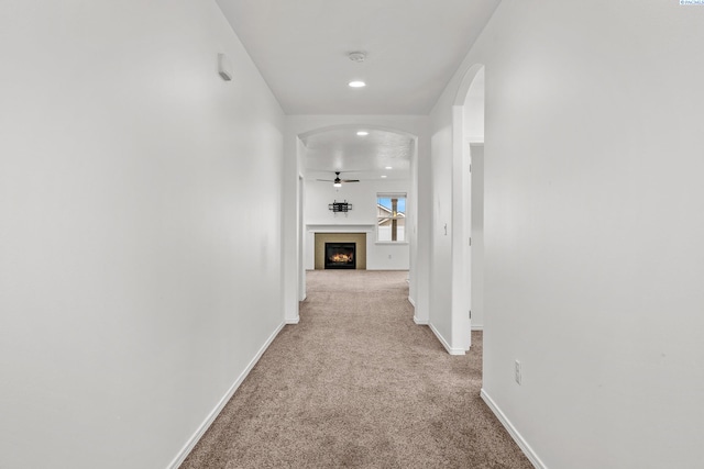 corridor featuring light carpet