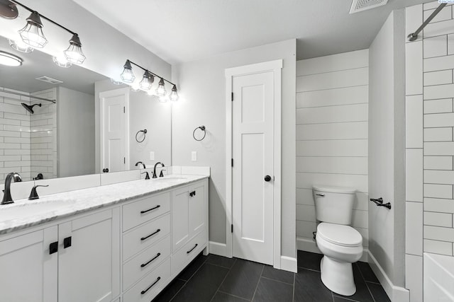 10401 N Mcdonald Rd, Prosser, WA 99350 - full bathroom featuring double vanity, tile patterned flooring, and a tile shower