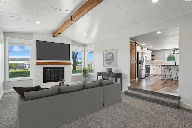 10401 N Mcdonald Rd, Prosser, WA 99350 - living area featuring carpet floors, a barn door, recessed lighting, and a large fireplace