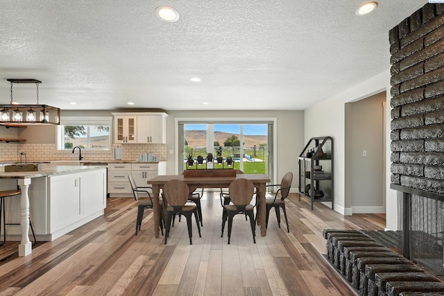 10401 N Mcdonald Rd, Prosser, WA 99350 - dining area with light wood-type flooring, a textured ceiling, and recessed lighting