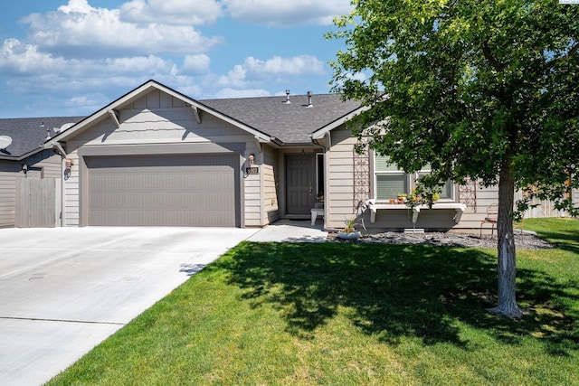 6903 Boulder Dr, Pasco, WA 99301 - view of front facade featuring a garage, driveway, and roof with shingles