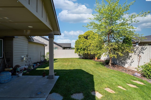 6903 Boulder Dr, Pasco, WA 99301 - fenced backyard with a patio area