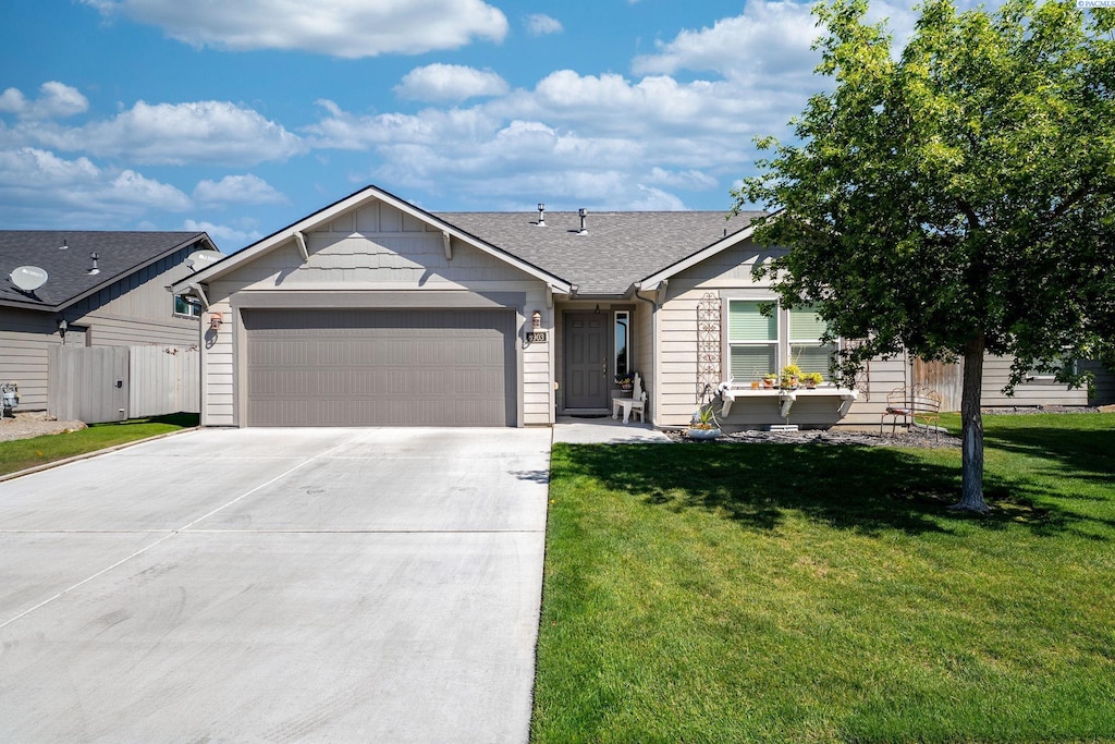 6903 Boulder Dr, Pasco, WA 99301 - ranch-style home with an attached garage, driveway, and a shingled roof