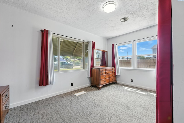 219 E 6th Ave, Kennewick, WA 99336 - carpeted spare room with a textured ceiling