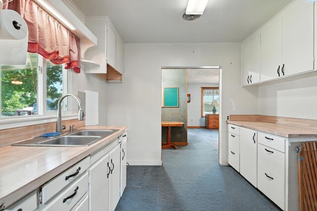 219 E 6th Ave, Kennewick, WA 99336 - kitchen with white cabinets and dark colored carpet