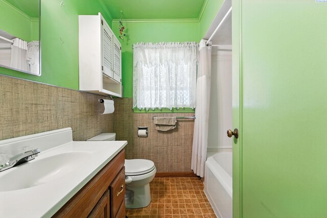 219 E 6th Ave, Kennewick, WA 99336 - bathroom featuring vanity, shower / tub combo with curtain, and crown molding