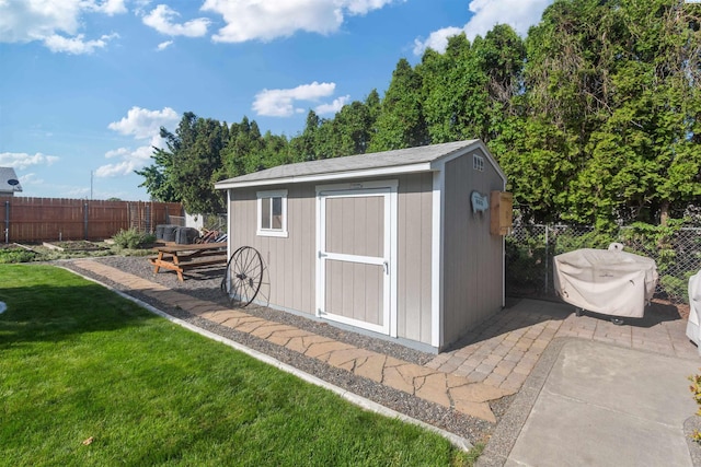 view of shed featuring a fenced backyard