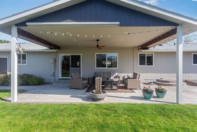 back of property featuring a ceiling fan, roof with shingles, a patio area, outdoor lounge area, and entry steps