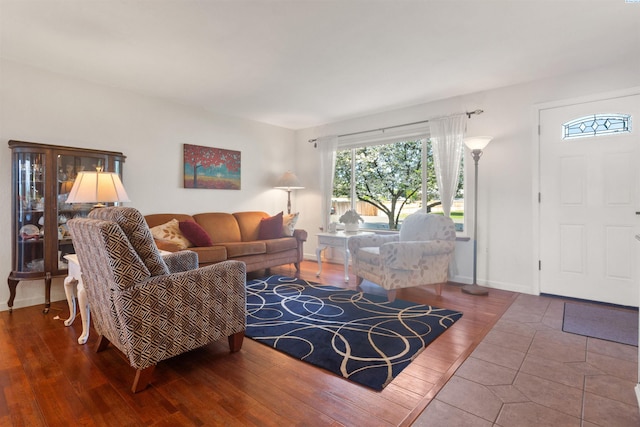 living room featuring baseboards and wood finished floors