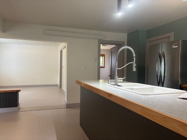 310 S Culton St, Palouse, WA 99161 - kitchen featuring freestanding refrigerator, light countertops, and light wood-style floors
