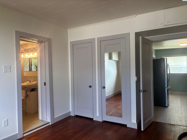 310 S Culton St, Palouse, WA 99161 - unfurnished bedroom with freestanding refrigerator and dark wood finished floors