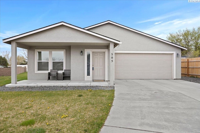 ranch-style house with a garage and a front lawn