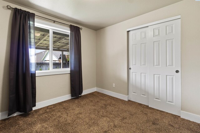 8112 Langara Dr, Pasco, WA 99301 - unfurnished bedroom with dark colored carpet and a closet