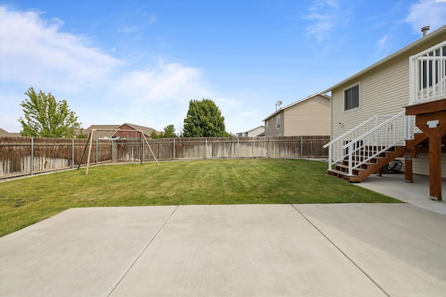 view of yard with stairway, a patio area, and a fenced backyard