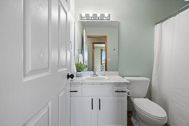 bathroom with vanity and toilet