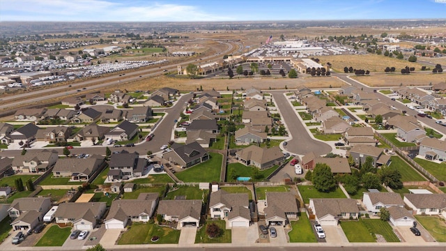 birds eye view of property with a residential view