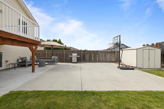 view of patio with an outdoor hangout area, a storage unit, an outdoor structure, and a fenced backyard