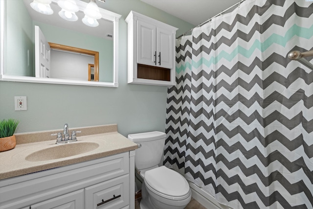 bathroom with a shower with shower curtain, visible vents, vanity, and toilet