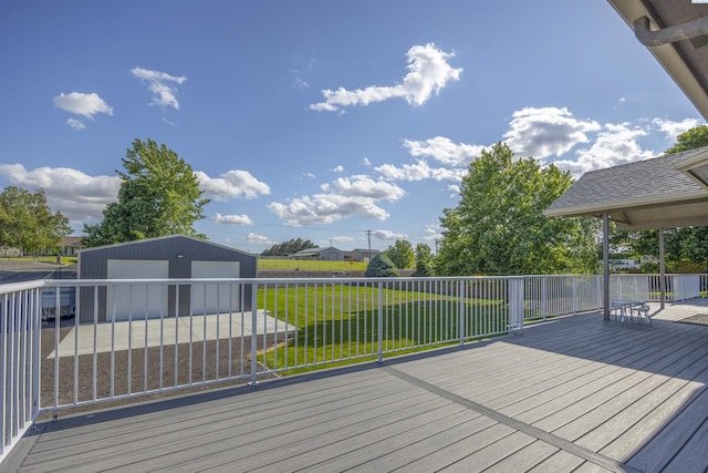 92104 E Sagebrush Rd, Kennewick, WA 99338 - wooden terrace featuring an outdoor structure, a garage, and a yard