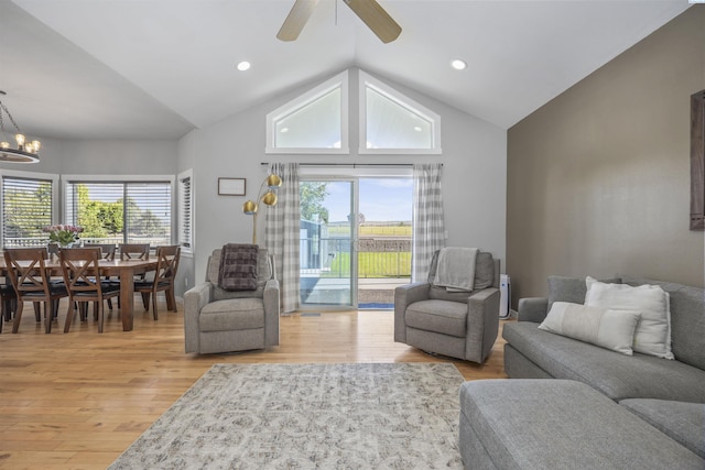 92104 E Sagebrush Rd, Kennewick, WA 99338 - living area with lofted ceiling, light wood-style floors, healthy amount of natural light, ceiling fan, and a chandelier