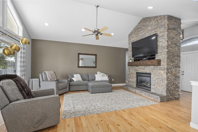 92104 E Sagebrush Rd, Kennewick, WA 99338 - living room featuring a ceiling fan, wood finished floors, a fireplace, and high vaulted ceiling