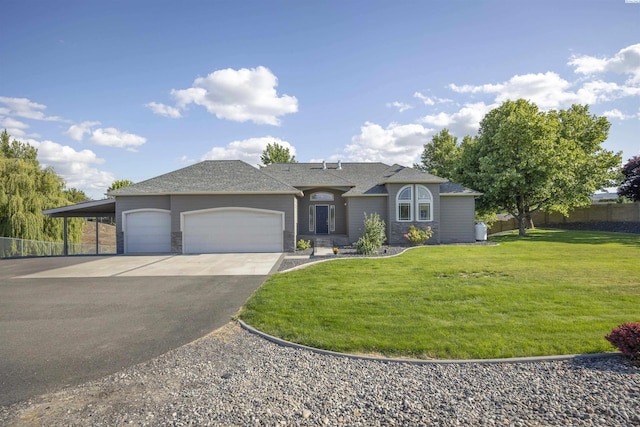 92104 E Sagebrush Rd, Kennewick, WA 99338 - view of front facade featuring asphalt driveway, a garage, a carport, and roof with shingles