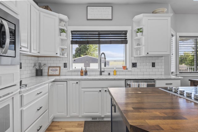 92104 E Sagebrush Rd, Kennewick, WA 99338 - kitchen with open shelves, a sink, appliances with stainless steel finishes, and healthy amount of natural light