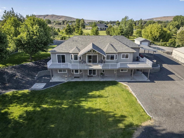 92104 E Sagebrush Rd, Kennewick, WA 99338 - view of front of house with a deck, a patio, and a front yard