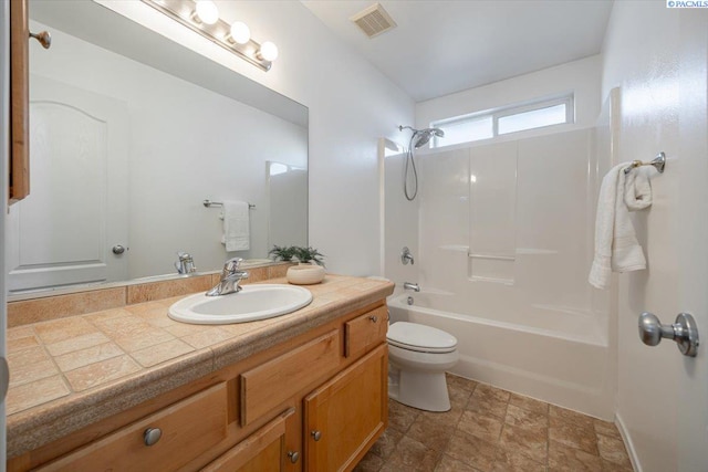 bathroom featuring bathtub / shower combination, visible vents, vanity, and toilet