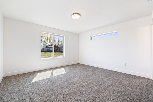 1613 Diamond Ave, Grandview, WA 98930 - carpeted empty room featuring plenty of natural light and baseboards