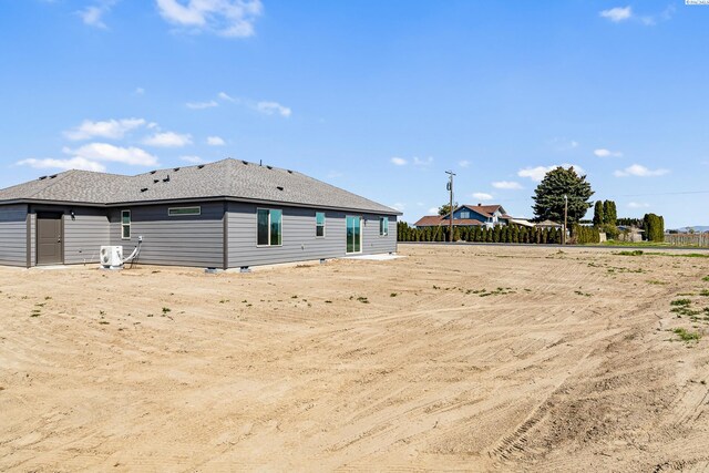 1613 Diamond Ave, Grandview, WA 98930 - rear view of house featuring central AC
