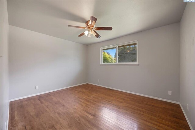 517 S Dawes St, Kennewick, WA 99336 - empty room with a ceiling fan, baseboards, and wood finished floors