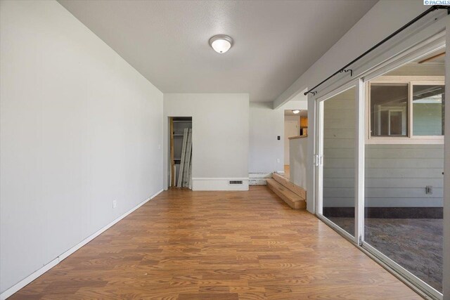 517 S Dawes St, Kennewick, WA 99336 - unfurnished room featuring wood finished floors and baseboards