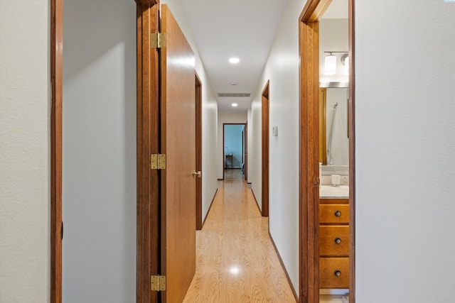 hall featuring recessed lighting and light wood-style flooring