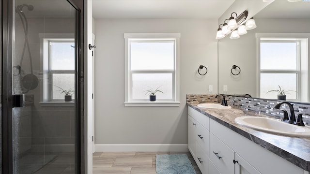 7104 W 31st Pl, Kennewick, WA 99338 - full bath featuring double vanity, a stall shower, and decorative backsplash